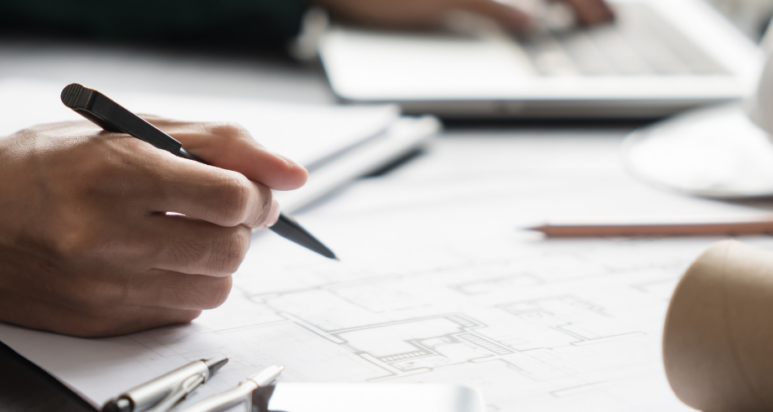 Aerial view of a smart city district in Abu Dhabi featuring solar-integrated buildings and green urban spaces.